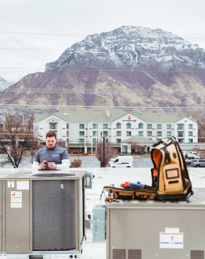 technician repairing an ac